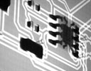 Figure 5. X-ray images illustrate BGA and surface mount components reflow soldered on the base of the board during simultaneous reflow